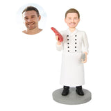 Chef figure holding a carrot
